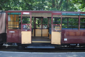 Accessible carriage with double doors. The doors are open and the carriage is located at a Puffing Billy platform.