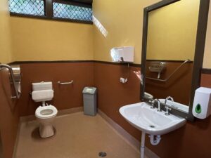 Accessible bathroom on the Lakeside station platform with guardrail installed.