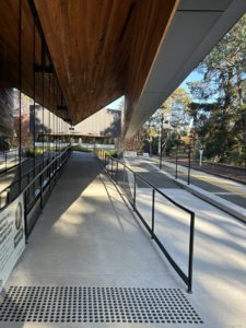 Ramp up to an alfresco deck. A train platform is located adjacent to the ramp.