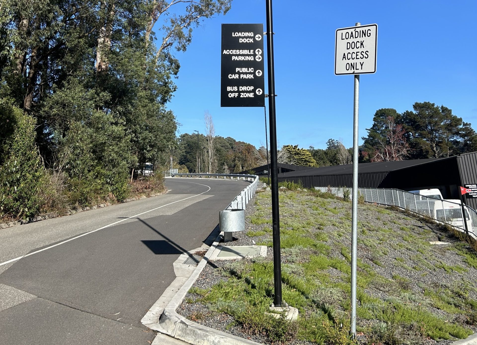 Road sign showing the directions to two accessible car parking areas as well as a public car park.