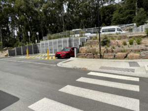 Three accessible car parking spots, with a zebra crossing opposite.