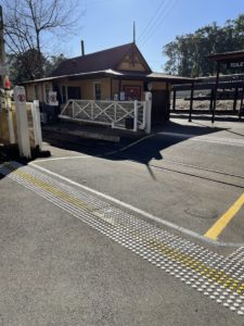 Tactile ground surface indicators at the Lakeside station pedestrian crossing.