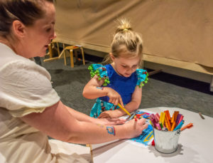 Young Girl Receives Help From Mum To Write Her Name On Her Junior Engineer Certificate