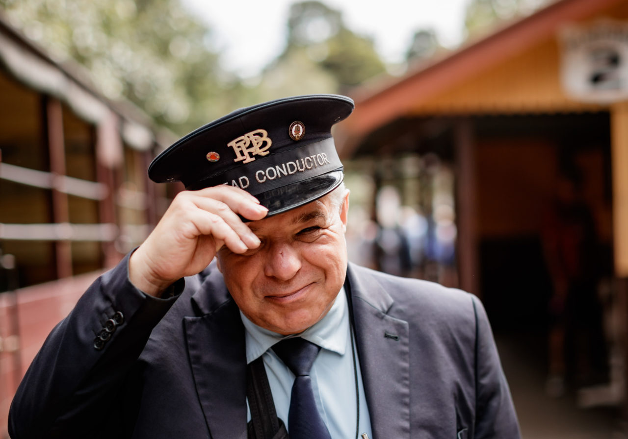 3 Volunteer Head Conductor On The Lakeside Station Platform