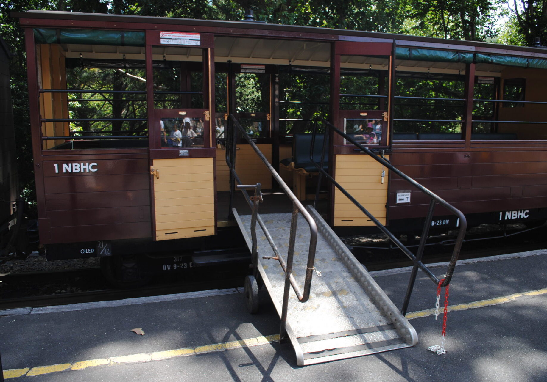 Accessible carriage with ramp attached so wheelchair users can board the carriage.