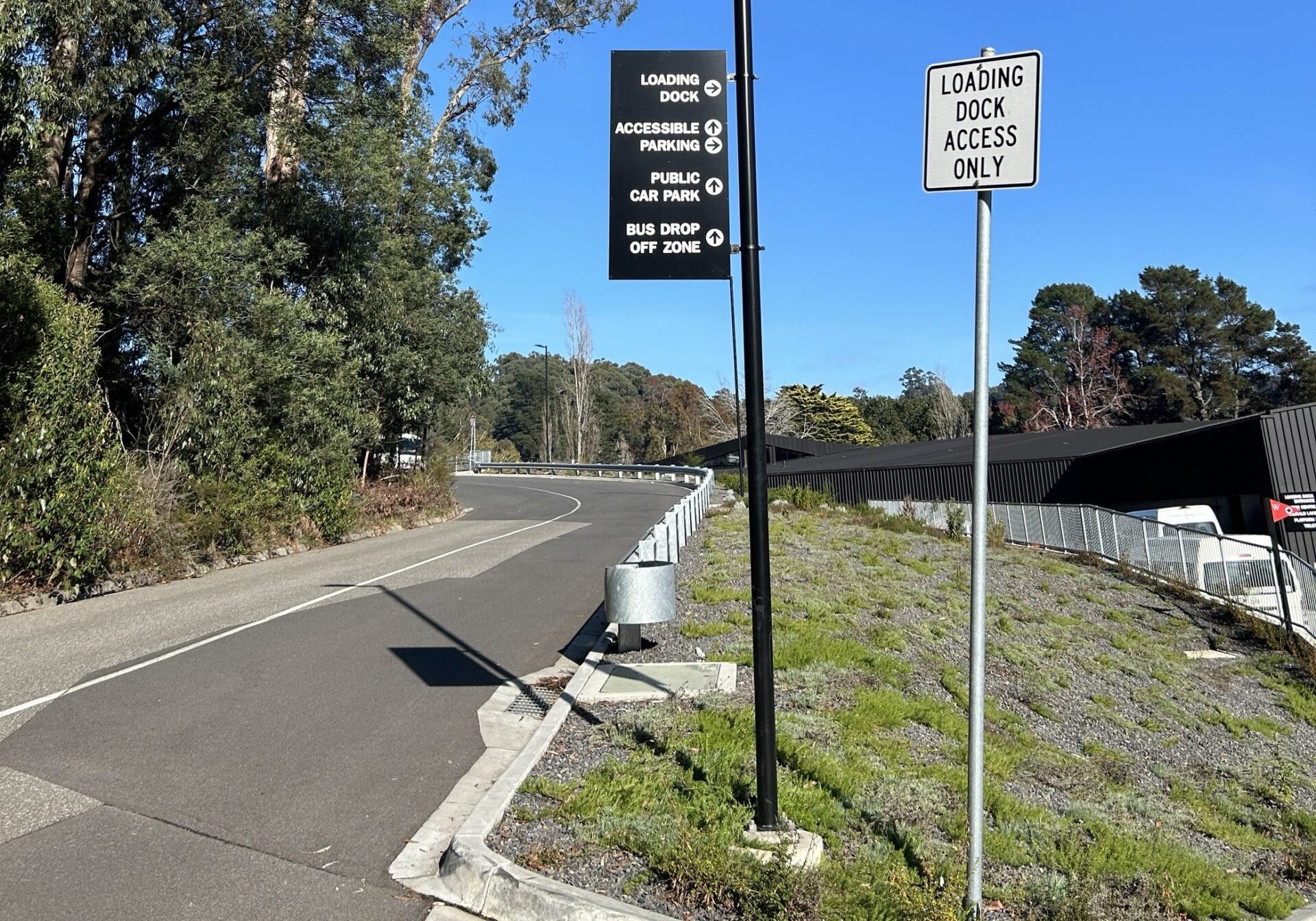 Road sign showing the directions to two accessible car parking areas as well as a public car park.