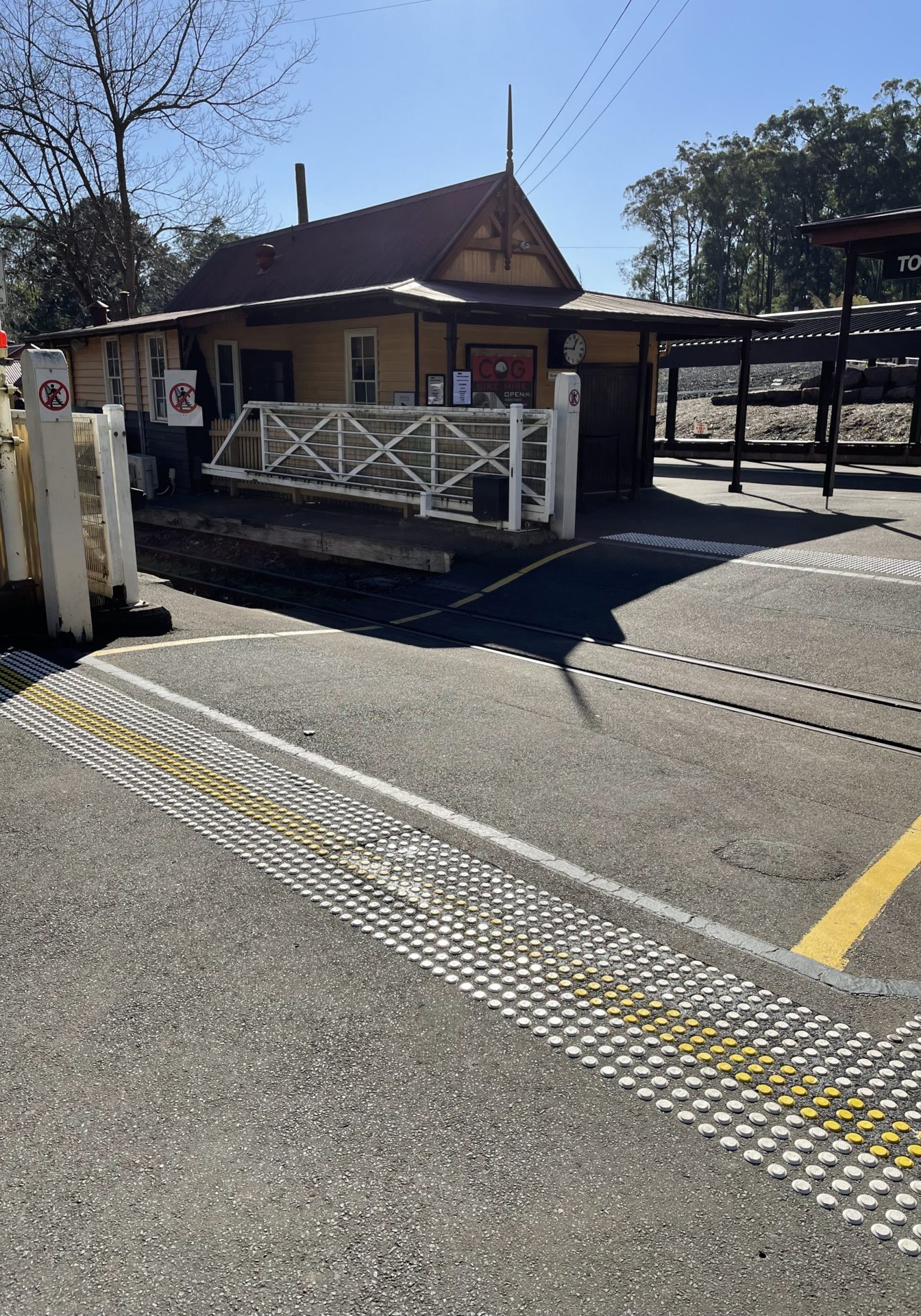 Tactile ground surface indicators at the Lakeside station pedestrian crossing.